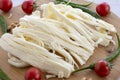 Angel Hair Cheese, or stringy cheese on wooden background