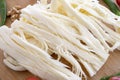 Angel Hair Cheese, or stringy cheese on wooden background. Close up