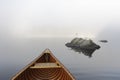 Cedar Canoe and Rocks on a Misty Ontario Lake