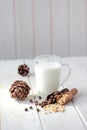 Cedar milk with pine nuts over white wooden table. Royalty Free Stock Photo