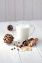 Cedar milk with pine nuts over white wooden table. Royalty Free Stock Photo