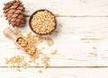 Cedar Pine nuts and cones on white wooden table Royalty Free Stock Photo