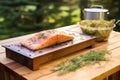 cedar plank and salmon fillet with a lid up smoker Royalty Free Stock Photo