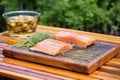 cedar plank and salmon fillet with a lid up smoker Royalty Free Stock Photo