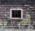 Cedar shingle barn wall with six pane window Royalty Free Stock Photo