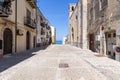 Cefalu, Italy - March 24, 2019: Empty walkway leading to Bastione di Capo Marchiafava bastion lookout point with a peek over the