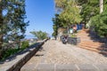 Cefalu, Italy - March 24, 2019: Entrance to Rocca di CefalÃÂ¹, stairs leading to the pathway to hill top with the sea in the