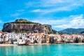 Cefalu, medieval town on Sicily island, Italy. Seashore village with beach and clear turquoise water of Tyrrhenian sea Royalty Free Stock Photo