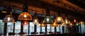 Ceiling adorned with a row of colorful pendant lights in a restaurant Royalty Free Stock Photo