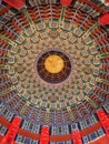 A ceiling with colorful circular patterns