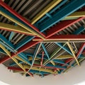 Ceiling with a complex geometric array of colorful, intersecting beams. Royalty Free Stock Photo
