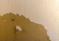 Ceiling damage in need of repair.  Home repair needed for damaged peeling plaster. Royalty Free Stock Photo