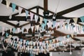 Ceiling decoration with paper flags and lightbulbs for birthday Royalty Free Stock Photo