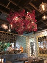 Ceiling decoration with red flowers in restaurant