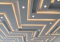 Ceiling design featuring a modern geometric pattern with recessed lighting. Rectangular and Royalty Free Stock Photo