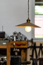 Ceiling fixture in the industrial factory with old machinery