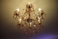 Ceiling gilded chandelier in classic interior Royalty Free Stock Photo