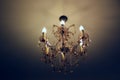 Ceiling gilded chandelier in classic interior Royalty Free Stock Photo