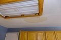 Ceiling kitchen in damage caused by a leaking water pipe Royalty Free Stock Photo