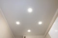 Ceiling in the kitchen, with four spotlights installed and turned on Royalty Free Stock Photo