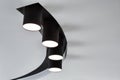 Ceiling lamp spotlight. Black spotlights on white ceiling. Modern lighting for a living room interior