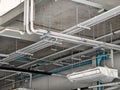 The ceiling of a large building under construction an extensive network of pipes Royalty Free Stock Photo