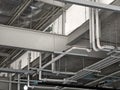 The ceiling of a large building under construction an extensive network of pipes Royalty Free Stock Photo