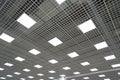 Ceiling lighting in the form of squares in a large room in a mall or warehouse