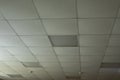 Ceiling is made of tiles in building. Interior of office is in detail Royalty Free Stock Photo