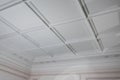 Ceiling moldings in the interior, detail of a angular ceiling skirting and lamps Royalty Free Stock Photo