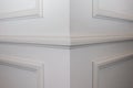 Ceiling moldings in the interior, detail of a angular wall skirting Royalty Free Stock Photo