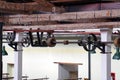 Ceiling mounted belts and pulleys in an old cotton processing factory