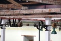 Ceiling mounted belts and pulleys in an old cotton processing factory