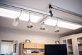 ceiling-mounted rail system with studio lights attached