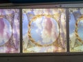 Ceiling panels with ornate golden frames and sky with clouds printed Royalty Free Stock Photo