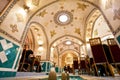 Ceiling and patterned walls inside the persian restaurant with eating people inside