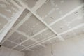 The ceiling of the room, covered with drywall sheets