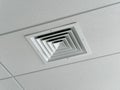 Ceiling socket for the ventilation duct of a cooling and heating system for large rooms, installed on a suspended ceiling Royalty Free Stock Photo