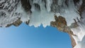 The ceiling of the stone grotto is covered with bizarre icicles Royalty Free Stock Photo