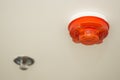 Ceiling white fire detector used to activate warning systems in