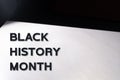 Celebrate Black History Month text on white paper with copy space Royalty Free Stock Photo