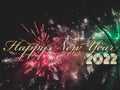 Celebrate concept, Happy new year 2022 greeting text with fireworks explosion on dark sky Royalty Free Stock Photo