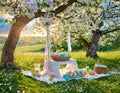 Easter Picnic in a Blooming Orchard on a Sunny Day