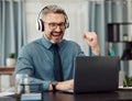 Celebrate, headphones and businessman working on a laptop with good news or achievement. Happy, excited and mature Royalty Free Stock Photo