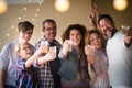 Celebrate people concept with different ages adult and young people toasting all together having fun and laughing a lot - from Royalty Free Stock Photo
