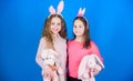 Celebrate spring. Happy easter. Egg hunt. Family and sisterhood. Little girls with hare toy. Spring holiday party Royalty Free Stock Photo