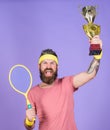 Celebrate victory. Tennis champion. Athletic man hold tennis racket and golden goblet. Win tennis game. Tennis player Royalty Free Stock Photo