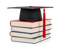 Celebrating academic achievement with a graduation cap on top of a book stack Royalty Free Stock Photo