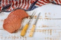 Celebrating America holidays is preparation raw beef steak on table a USA flag