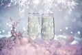 Celebrating Christmas or New Year eve party with Bengal lights and champagne. Beautiful shiny place setting Royalty Free Stock Photo